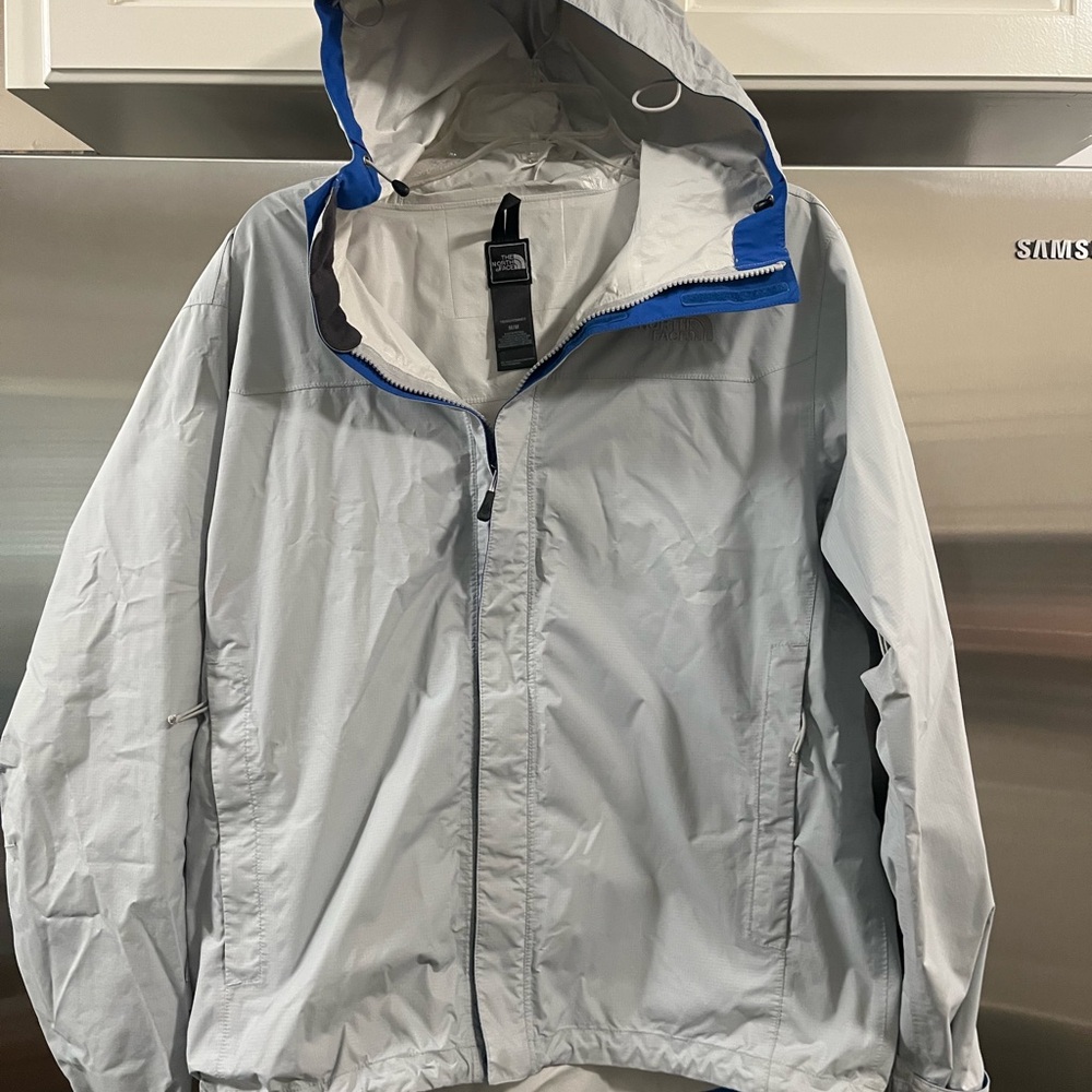 The North Face Light Grey Hooded  rain Jacket with Blue Trim